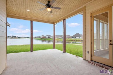 Large back porch for entertaining with custom cypr