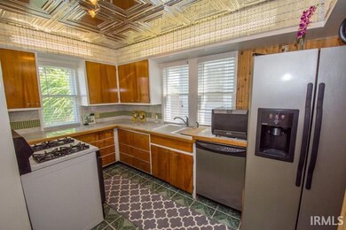Kitchen with stainless steel appliances and marble