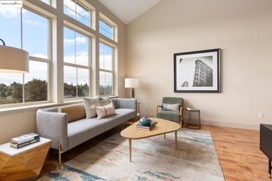 Living area with lofted ceiling and light wood-style floors