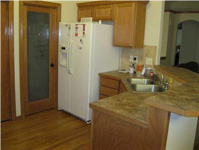 Kitehen with the door to the walk in pantry