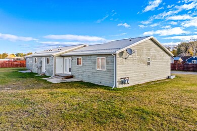 Back of house with a metal roof