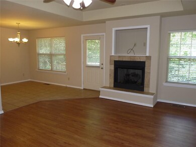 Off to the side of the living room is the dining room and access to the deck.