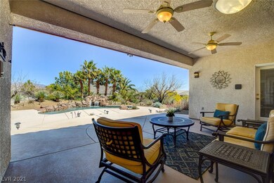 Stepping out into the backyard, the covered patio