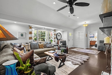 Living room featuring a ceiling fan, wood finished floors, recessed lighting, and lofted ceiling