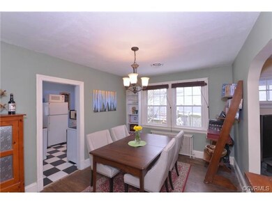 Between the living room and the kitchen, you'll fi