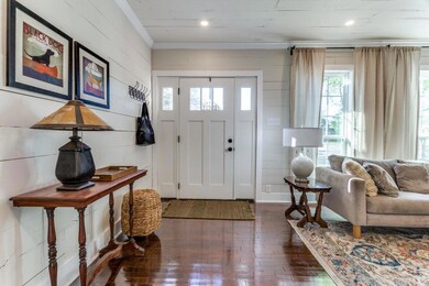 AS YOU ENTER THE FRONT DOOR, NOTICE THE BEAUTIFUL 