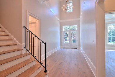 Entrance hall with soaring 24ft ceiling.