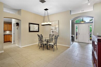 Dining area with upgraded lighting and access to front entrance
