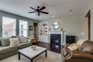 Great room with gas fireplace and built-n-bookcases with granite countertop.