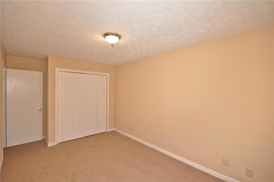 Unfurnished bedroom with carpet flooring, a closet