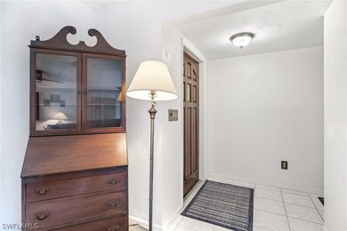 Entryway with light tile floors