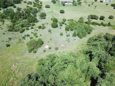 Utility poles approx western property line.