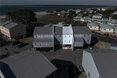 Birds eye view of property with a water view and a