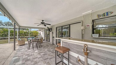 Custom all-weather bar, new tile and new furnishings in the lanai