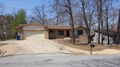 Exterior view of the home from the street & driveway.