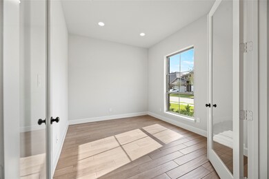 The home office is just off the foyer and features