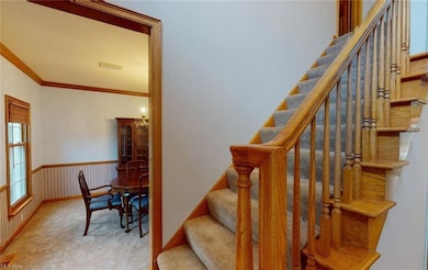 2 story foyer with rich wood flooring welcomes you