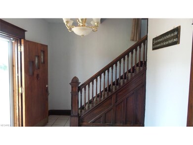 Entry Way.  Original hardwood staircase.