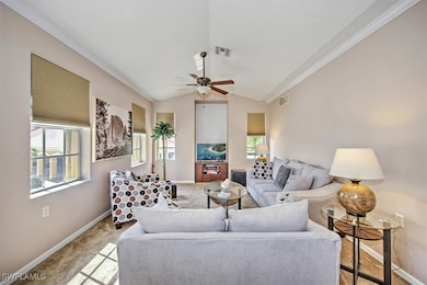 Living room with vaulted ceilings & lighted ceilin