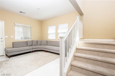 LIVING ROOM WITH STAIRS LEADING TO THE UPSTAIRS LI