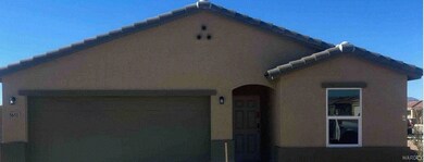 View of side of property with a garage