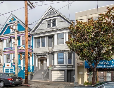 This stately Victorian duplex features a 3 bedroom