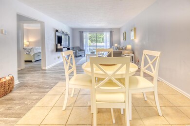 Dining space with a textured ceiling and light har