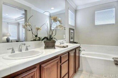 Light & bright master bath with dual sinks & soaki