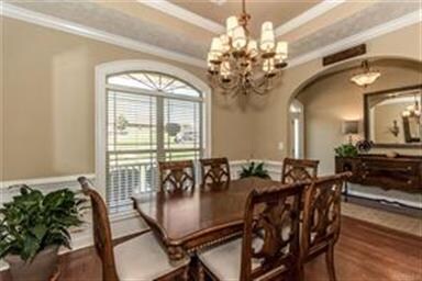 ARCHED ENTRY FROM FOYER TO FORMAL DINING ROOM