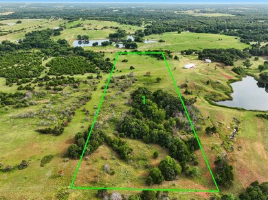 Birds eye view of property featuring a rural view 