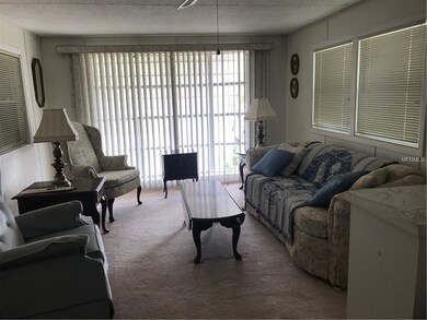 Furnished living room with full front window and l