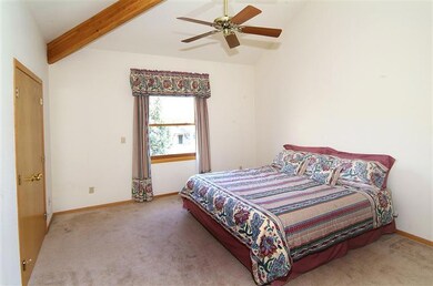 Spacious master suite with vaulted ceili