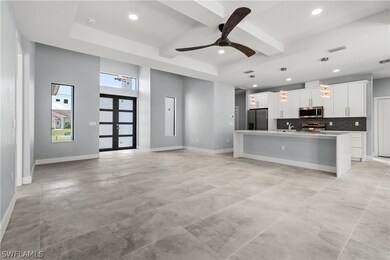 Kitchen with hanging light fixtures, stainless ste