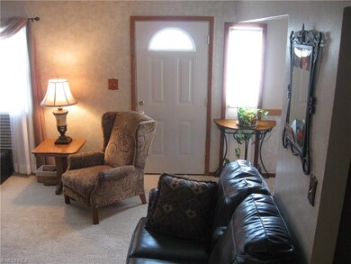 The front entryway leads you into the cozy living 