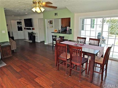 Dining area overlooks the patio and backyard area-