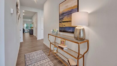 Hall featuring baseboards and wood finished floors