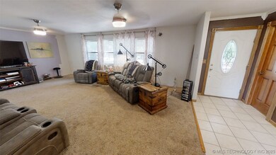 Front entry opens to a guest bath on the left and