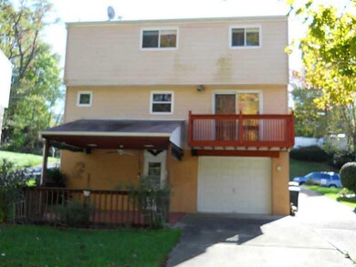 Exterior Back. Showing covered patio and garage.