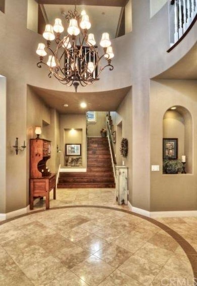 Gorgeous entry with travertine, art niches and all