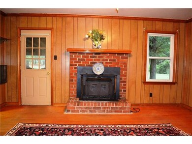 Paneled family room den, wood floors and wood burn