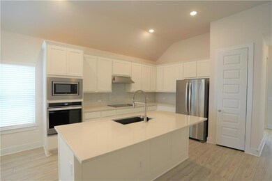 Kitchen featuring appliances with stainless steel