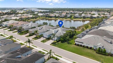 Birds eye view of property with a water view and a