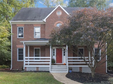 A brick front with cozy front porch.