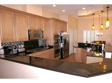 Property Photo. Kitchen with granite counters, cus