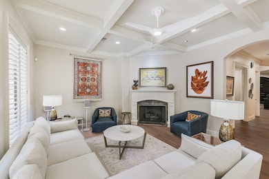 Family Room with beautiful stone surround gas log fireplace. Virtually renovated floors