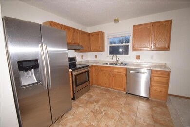 KITCHEN HAS STAINLESS STEEL APPLIANCES WHICH WILL REMAIN FOR THE NEW OWNER