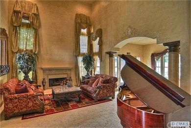 Living Room with custom fireplace and wall finishe