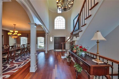Foyer opens to formal dining room, office to the r