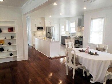 FORMAL DINING ROOM OPEN INTO THE BEAUTIFULLY RENOV