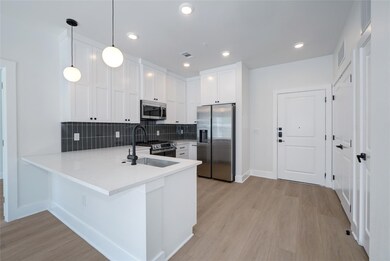 Kitchen with stainless steel appliances, a sink, 